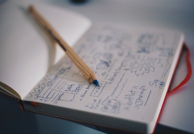 Planning notes and a pencil for organizing a service business website structure