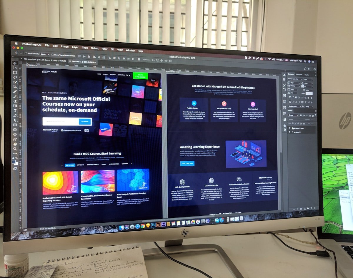 Desktop screen displaying website design layouts